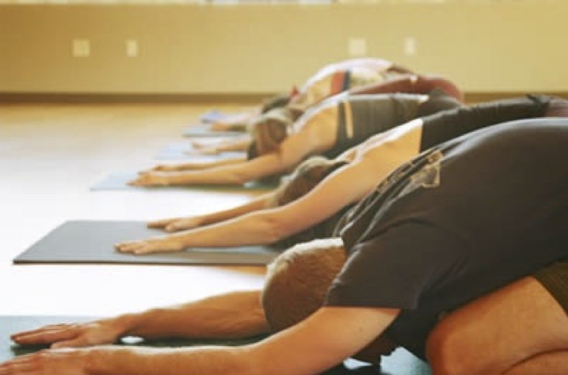 Picture showing people doing yoga for beginners