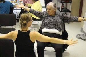 Picture of two women performing yoga in Tofino Yoga