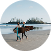 two surfers walking in the shore